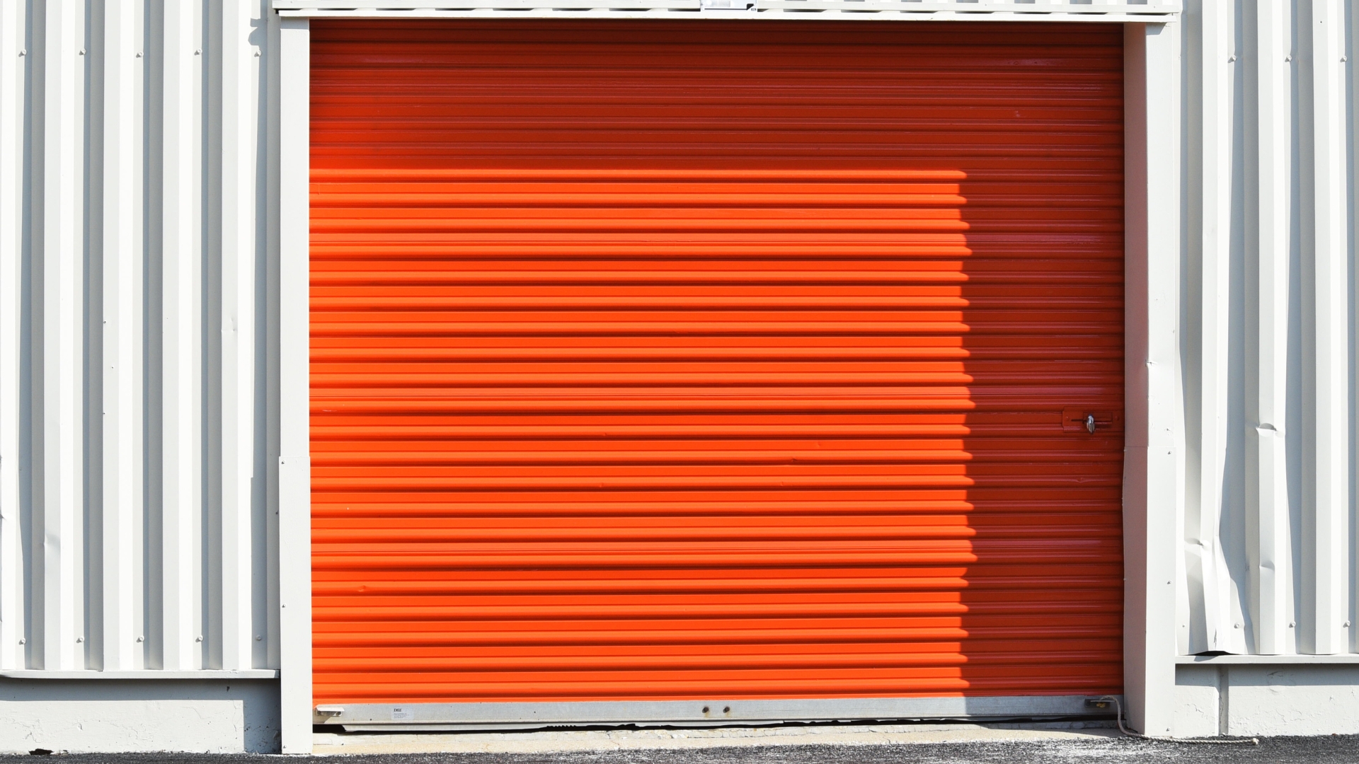 A roll-up garage door in a warehouse