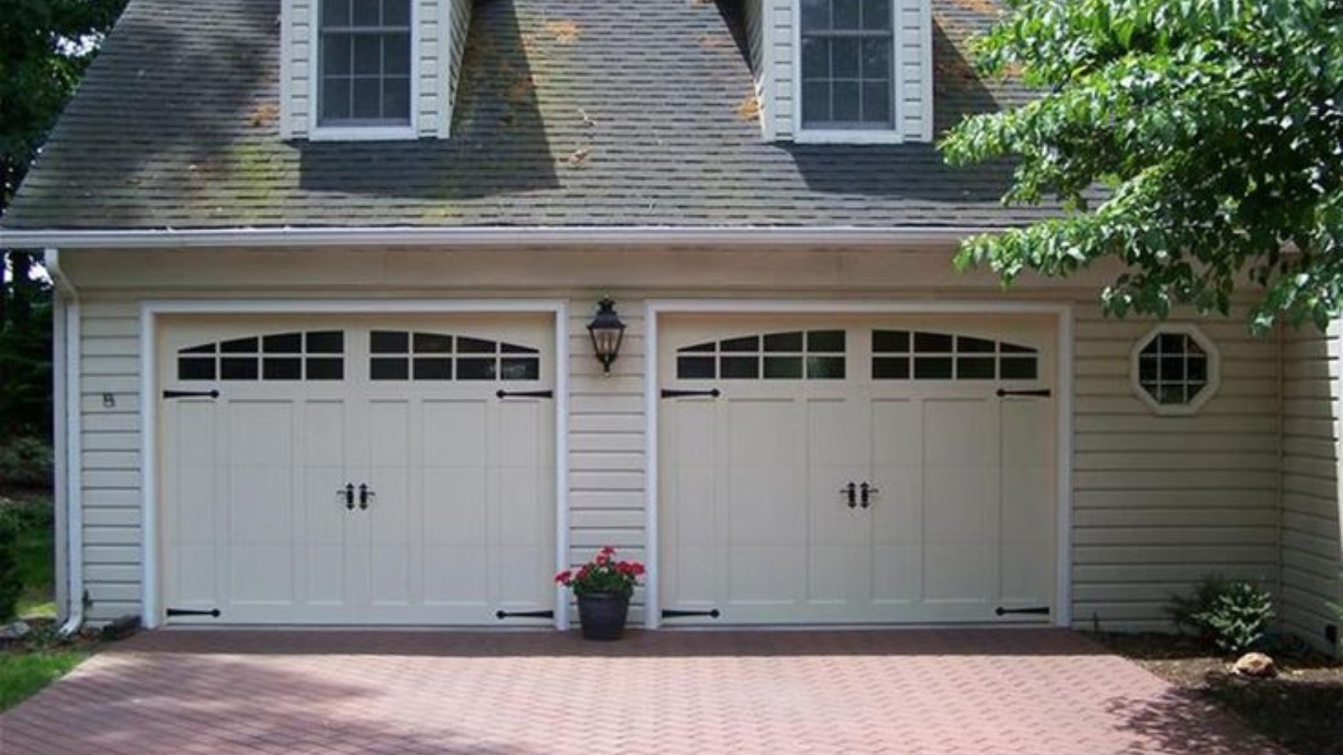 A garage door with decorative hardware installed