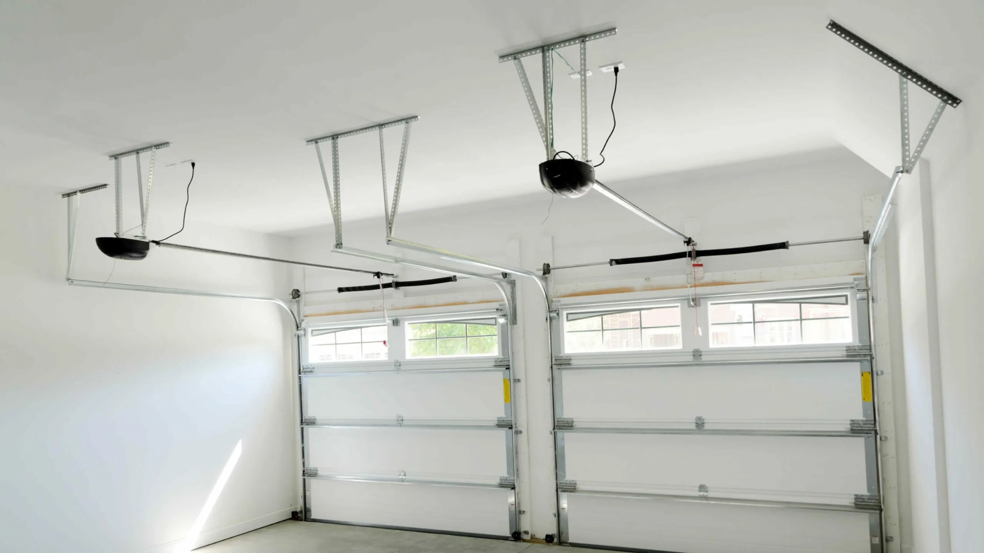 A garage with two garage door opener installed for the two door system