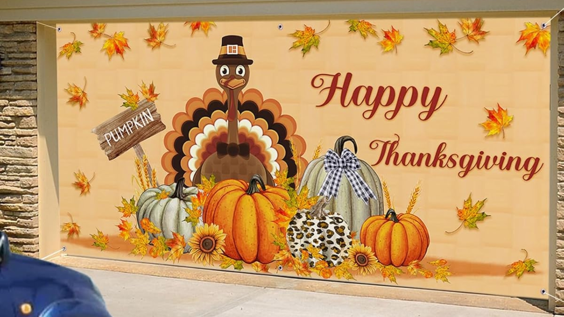 Thanksgiving garage door decor with autumn colors and cheerful turkey artwork.