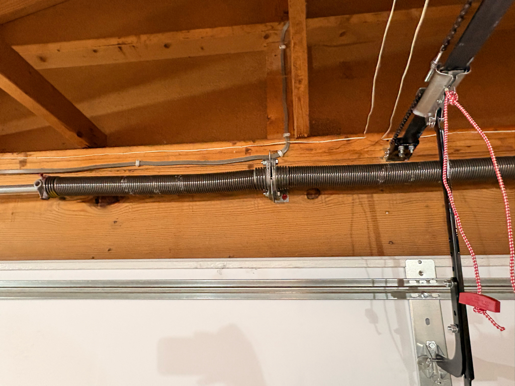 garage door torsion spring  installed above a garage door