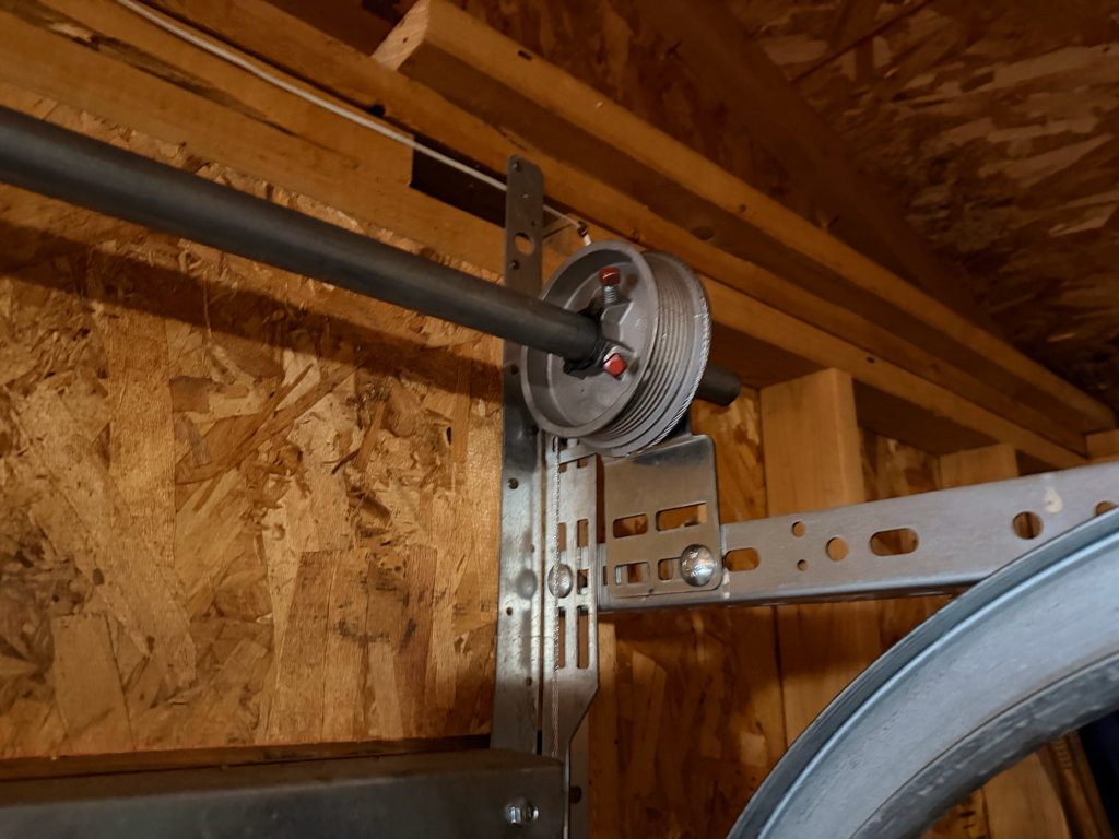  Residential garage door with a cable installed.