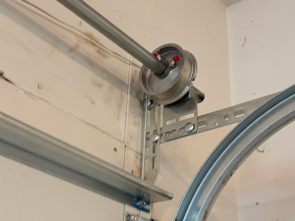 garage door cable installed above a garage door
