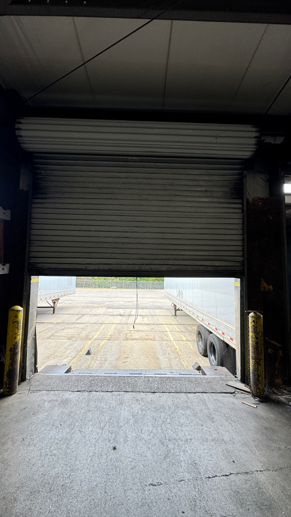 Commercial garage door stuck halfway open