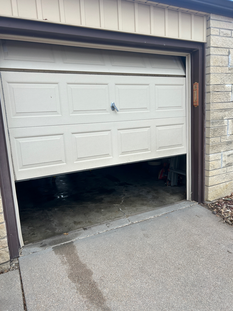 Overhead garage door won't open and needs repair