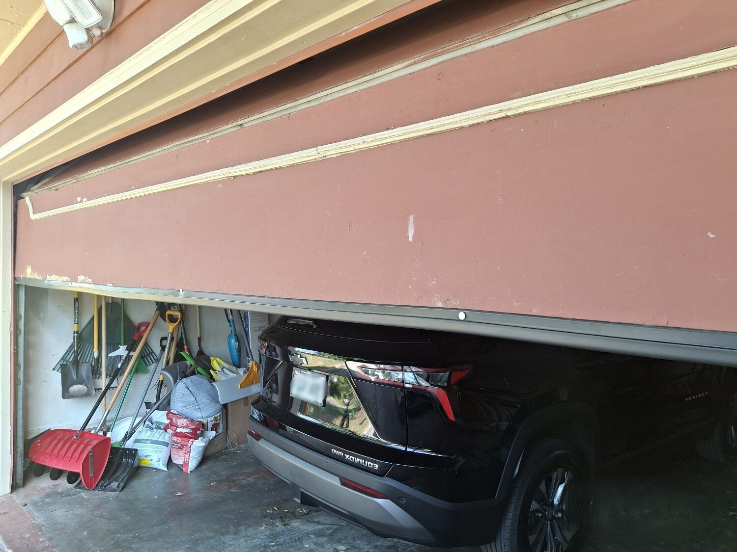 Residential garage door won't open because of damaged hardware